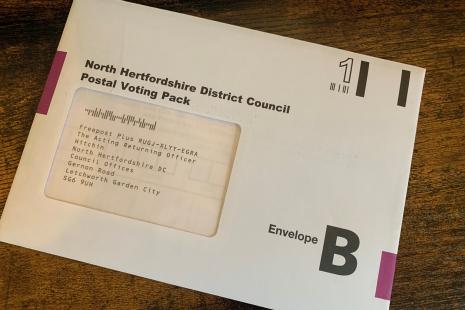 A postal vote pack envelope, addressed to North Hertfordshire District Council