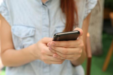 Woman holding a smartphone