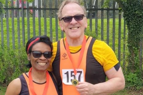 Tim and Joy at the Hertfordshire County Championships in 2022, both holding medals hung around their necks