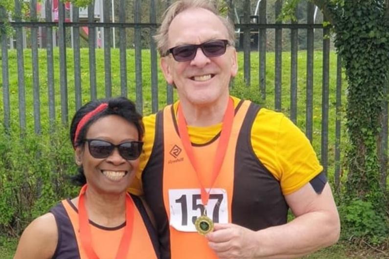 Tim and Joy at the Hertfordshire County Championships in 2022, both holding medals hung around their necks