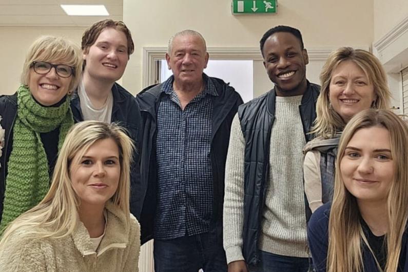 Members of Caudwell Youth. A group of people smiling and looking at the camera.