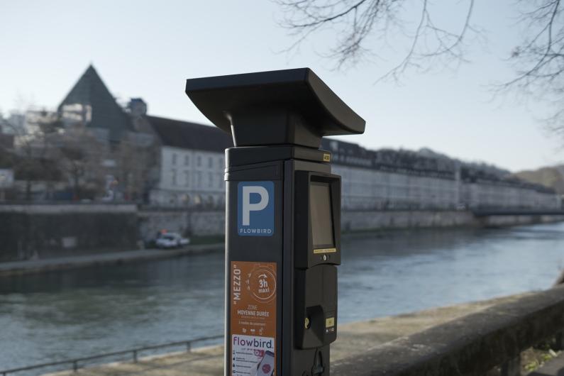 One of the new parking machines in situ with a river and building in the background - not in North Herts